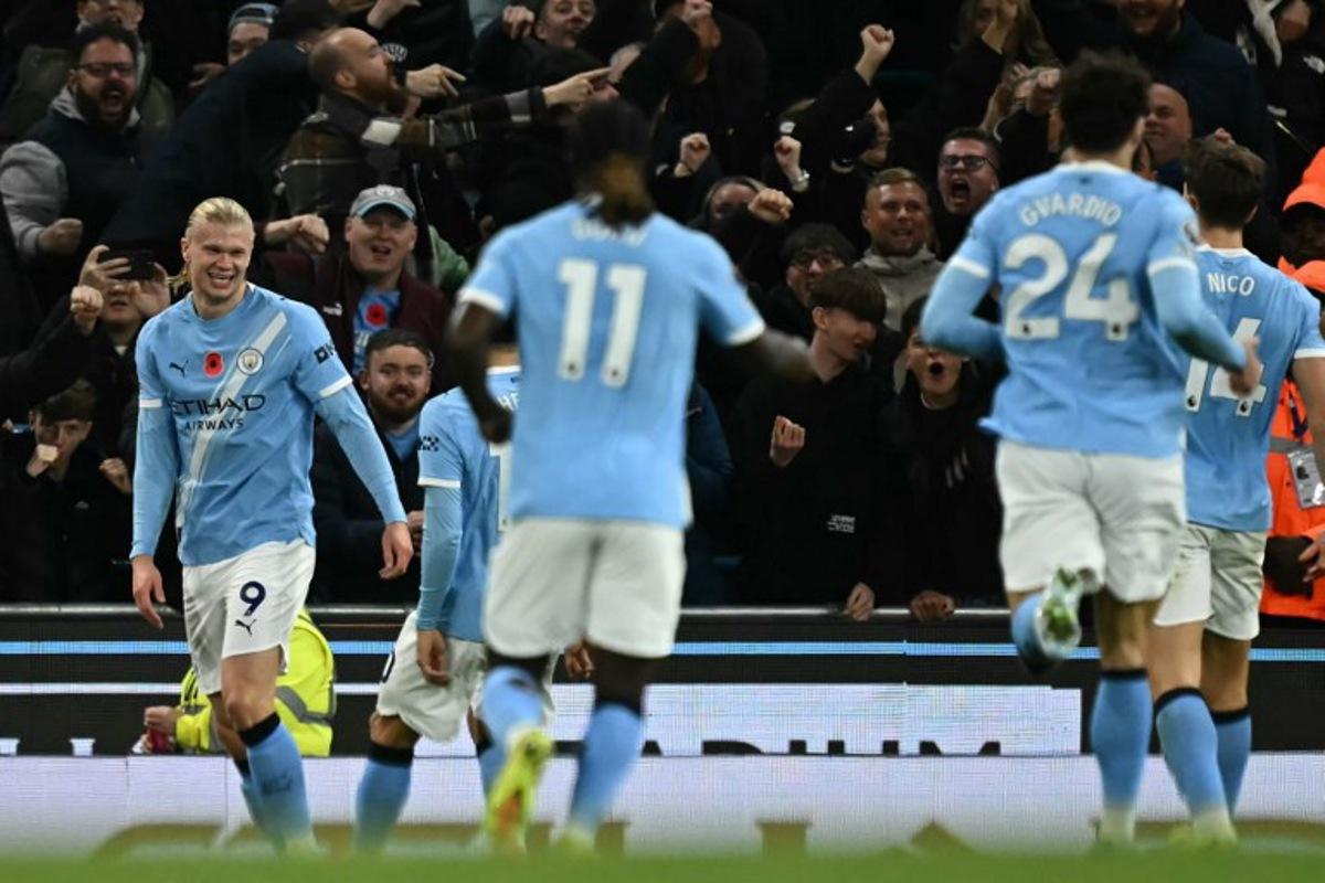 Manchester City's Norwegian striker #09 Erling Haaland (L) celebrates after scoring their second goal during the English Premier League football match between Manchester City and Bournemouth at the Etihad Stadium in Manchester, north west England, on November 2, 2025.  Paul ELLIS / AFP