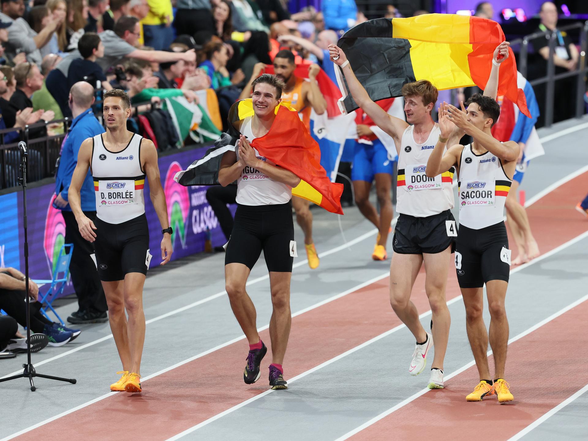 Belgian Dylan Borlee, Belgian Christian Iguacel, Belgian Alexander Doom and Belgian Jonathan Sacoor celebrate after winning the final of the men's 4x400m relay event, on day three of the World Athletics Indoor Championships in Glasgow, Scotland, UK, on Sunday 03 March 2024. The Worlds are taking place from 01 to 03 March 2024. BELGA PHOTO BENOIT DOPPAGNE