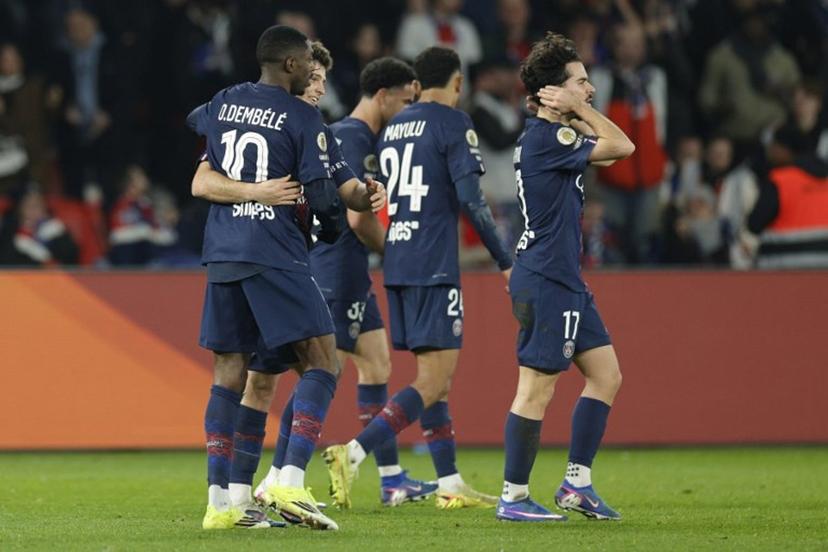 Paris Saint-Germain's French forward #10 Ousmane Dembele (L) celebrates with Paris Saint-Germain's Portuguese midfielder #87 Joao Neves (2L) after scoring Paris Saint-Germain's second goal during the French L1 football match between Paris Saint-Germain (PSG) and Olympique de Marseille (OM) at the Parc des Princes stadium in Paris on February 8, 2026.  GEOFFROY VAN DER HASSELT / AFP