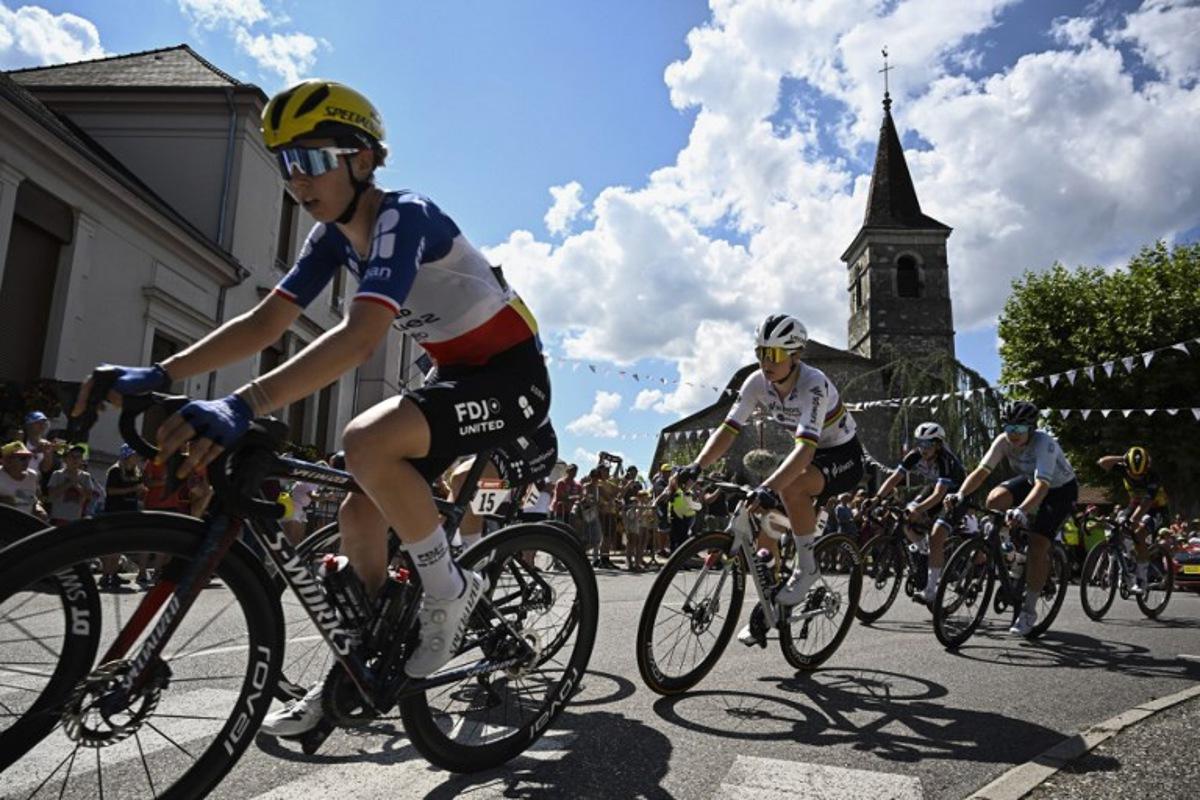 (FILES) FDJ-SUEZ team's French rider Marie Le Net (L) and Team SD Worx - Protime's Belgian rider Lotte Kopecky (C) ride in a breakaway during the 7th stage (out of 9) of the fourth edition of the Women's Tour de France - Tour de France Femmes cycling race, 159.7 km from Bourg-en-Bresse to Chambéry, in Chambéry, south-eastern France on August 1, 2025. The 5th edition of the Women's Tour de France will start in Lausanne on August 1, 2026. JULIEN DE ROSA / AFP