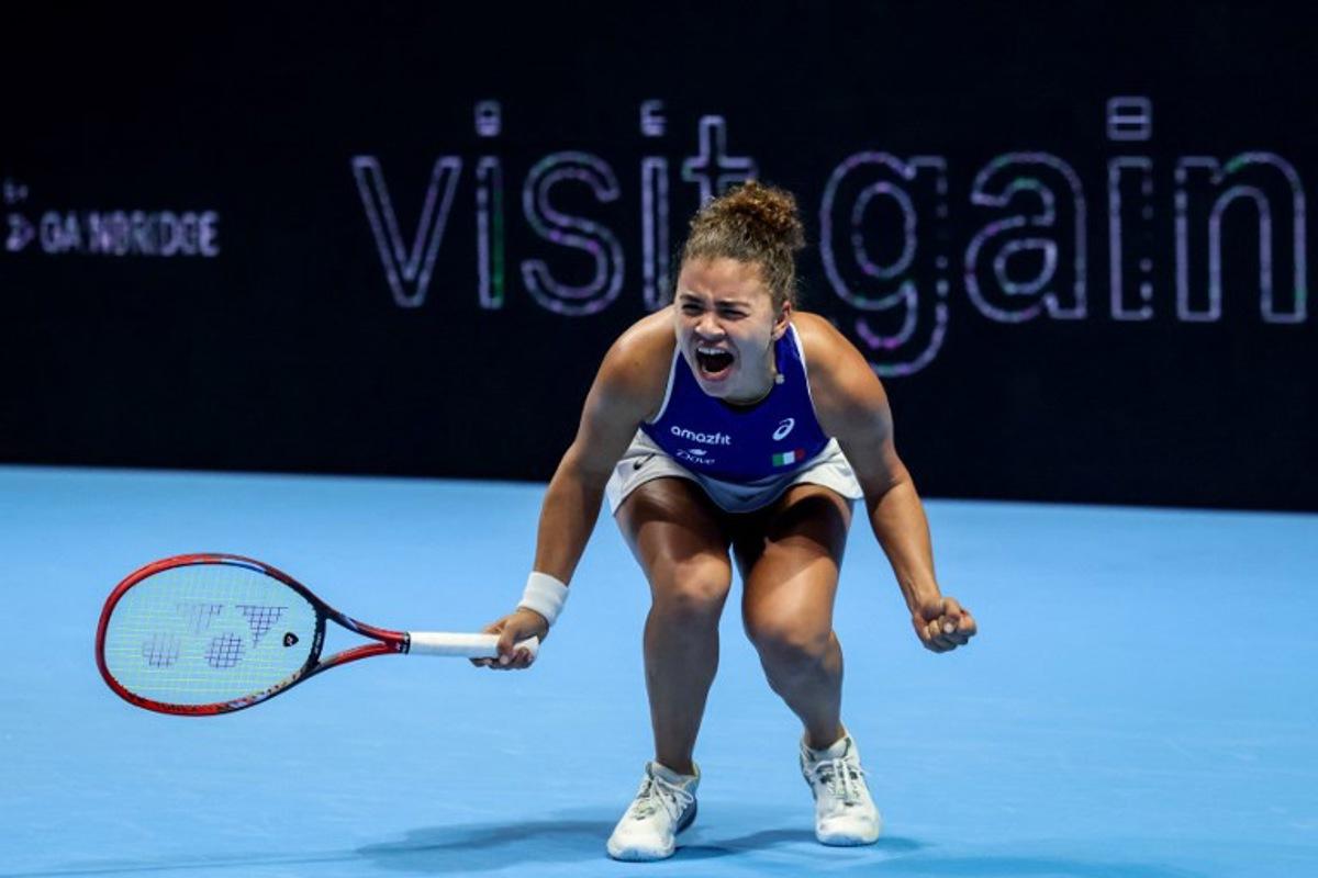Italy's Jasmine Paolini reacts as she plays against Ukraine's Elina Svitolina during their second singles semi-final match at the Billie Jean King Cup in Shenzhen, southern China's Guangdong province on September 19, 2025.  STR / AFP