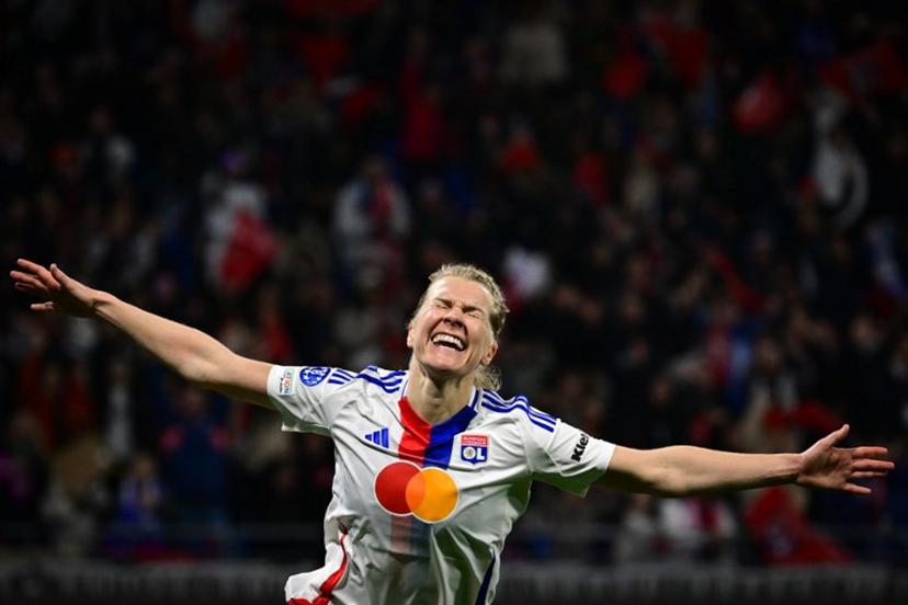 Lyon's Norwegian forward #14 Ada Hegerberg celebrates after scoring Lyon's fourth goal during the UEFA Women's Champions League quarter final second leg football match between Olympique Lyonnais (FRA) and FC Bayern Munich (GER) at the OL Stadium in Decines-Charpieu, central-eastern France, on March 26, 2025.  OLIVIER CHASSIGNOLE / AFP