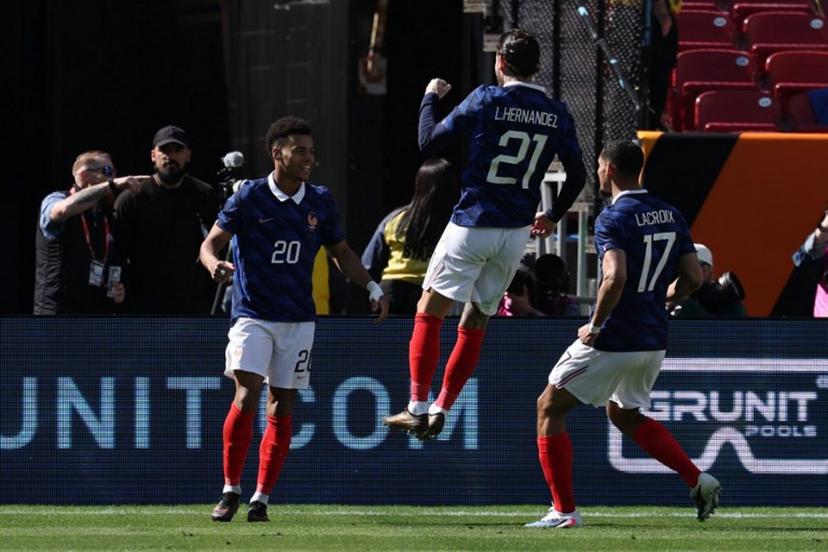 France's forward #20 Desire Doue celebrates with France's defender #21 Lucas Hernandez and France's defender #17 Maxence Lacroix after scoring during a friendly football match between Colombia and France at Northwest Stadium in Landover, Maryland, on March 29, 2026.  FRANCK FIFE / AFP