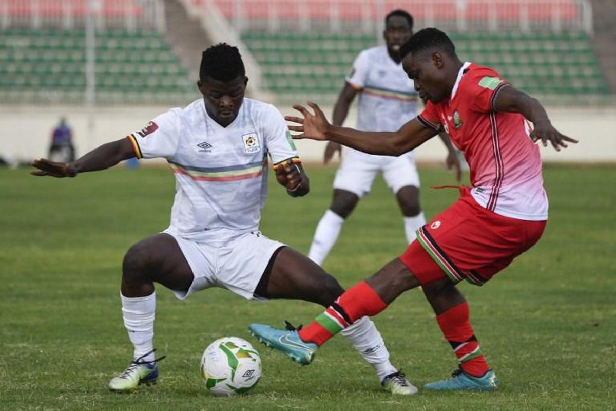 Uganda's Ibrahim Orit (L) fights for the ball with Kenya's Erick Otieno (R) during the FIFA World Cup Qatar 2022 qualifying round Group E football match between Kenya and Uganda at the Nyayo National Stadium in Nairobi on September 2, 2021.  TONY KARUMBA / AFP