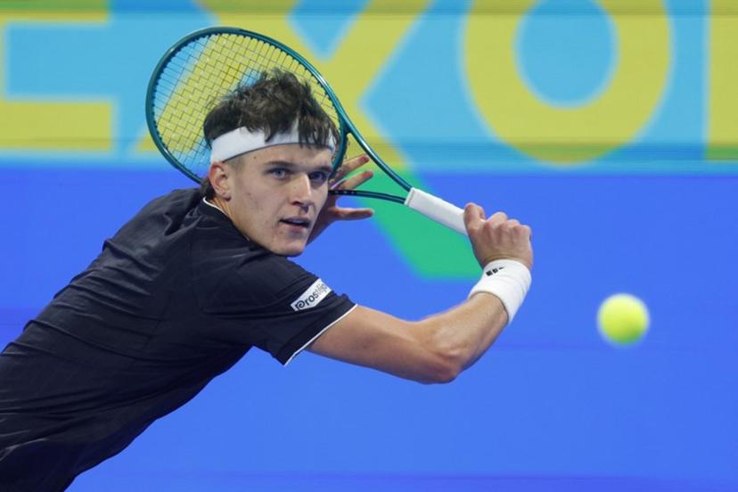 Czech Republic's Jakub Mensik hits a return against France's Arthur Fils during their men's singles semi-final match at the Qatar Open tennis tournament in Doha on February 20, 2026.  Karim JAAFAR / AFP