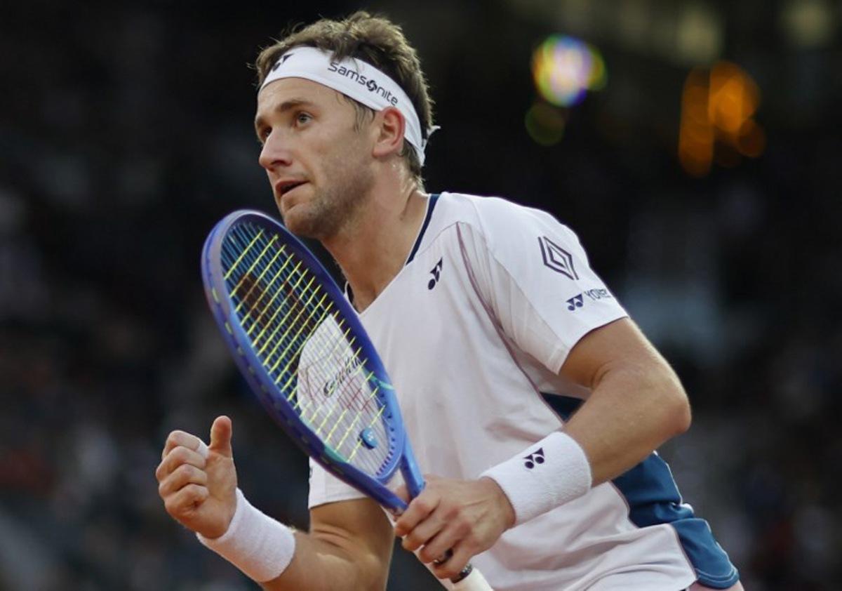 Norway's Casper Ruud reacts during his 2025 ATP Tour Madrid Open tennis tournament singles final match against Britain's Jack Draper at the Caja Magica in Madrid, on May 4, 2025.  OSCAR DEL POZO / AFP