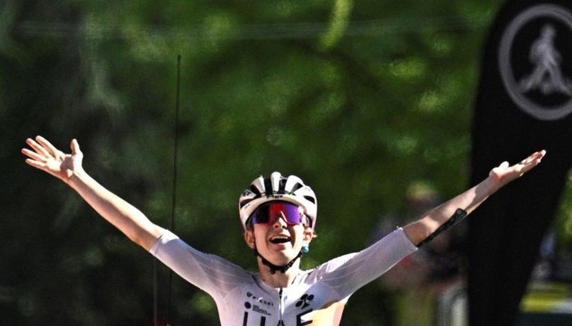 UAE Team ADQ's French rider Maeva Squiban celebrates as she crosses the finish line to win the 7th stage (out of 9) of the fourth edition of the Women's Tour de France cycling race, 159.7 km from Bourg-en-Bresse to Chambéry, in Chambéry, south-eastern France on August 1, 2025.  JULIEN DE ROSA / AFP