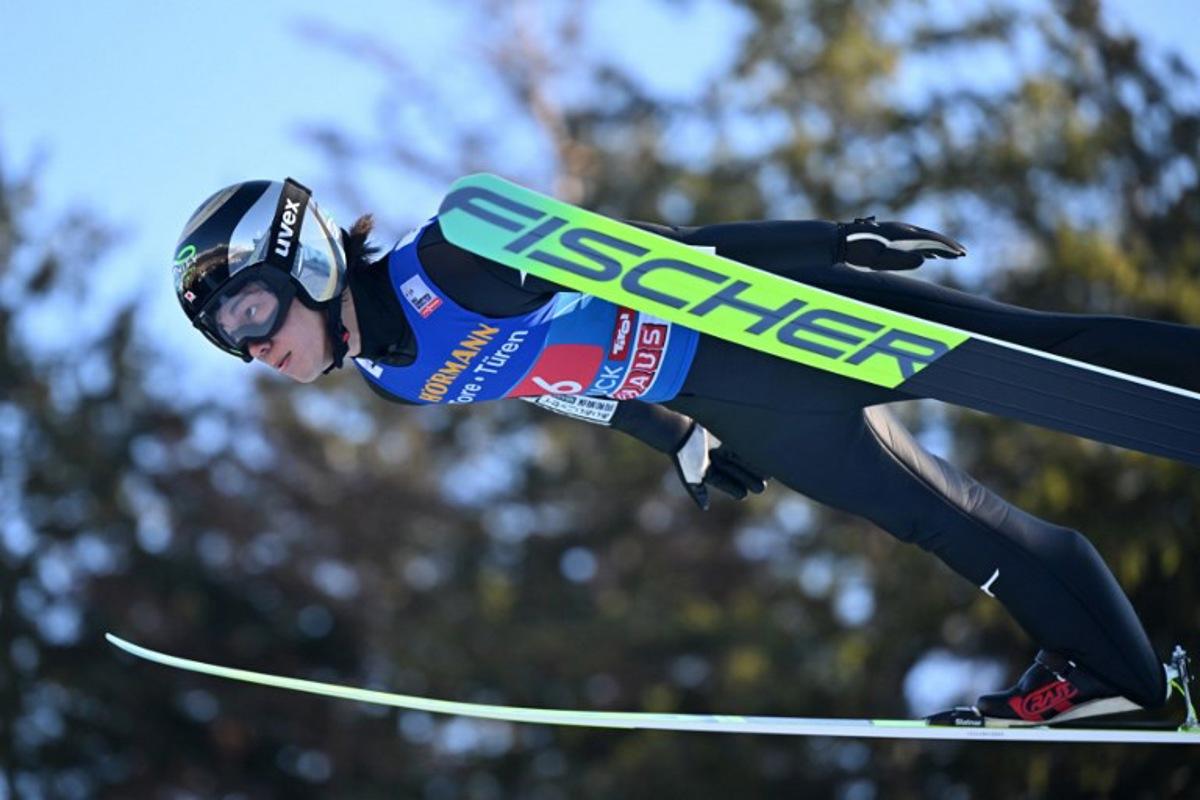 Japan's Ren Nikaido soars through the air during the trial round for the Men's Individual Large Hill HS128 event of the FIS Ski Jumping World Cup, the third leg of the Four Hills Tournament, in Innsbruck, Austria on January 4 , 2026.  KERSTIN JOENSSON / AFP