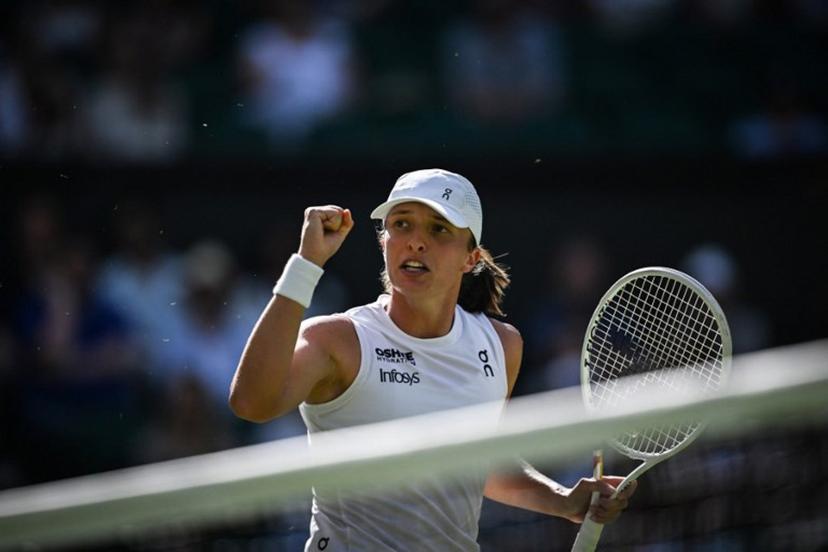 Poland's Iga Swiatek reacts after a point against Switzerland's Belinda Bencic during their women's singles semi-final tennis match on the eleventh day of the 2025 Wimbledon Championships at The All England Lawn Tennis and Croquet Club in Wimbledon, southwest London, on July 10, 2025.  Kirill KUDRYAVTSEV / AFP