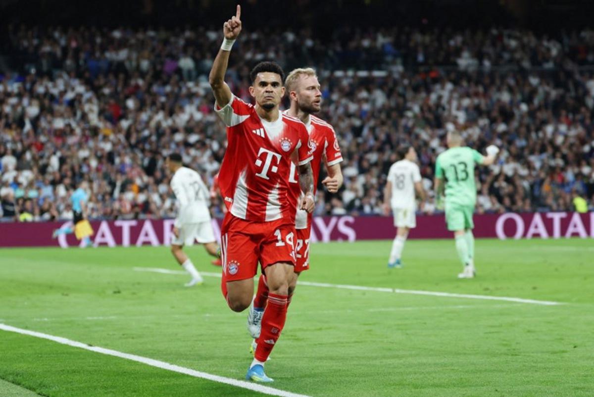 Bayern Munich's Colombian forward #14 Luis Diaz celebrates scoring the opening goal during the UEFA Champions League quarter final first leg football match between Real Madrid CF and FC Bayern Munich at Santiago Bernabeu Stadium in Madrid on April 7, 2026.  Thomas COEX / AFP