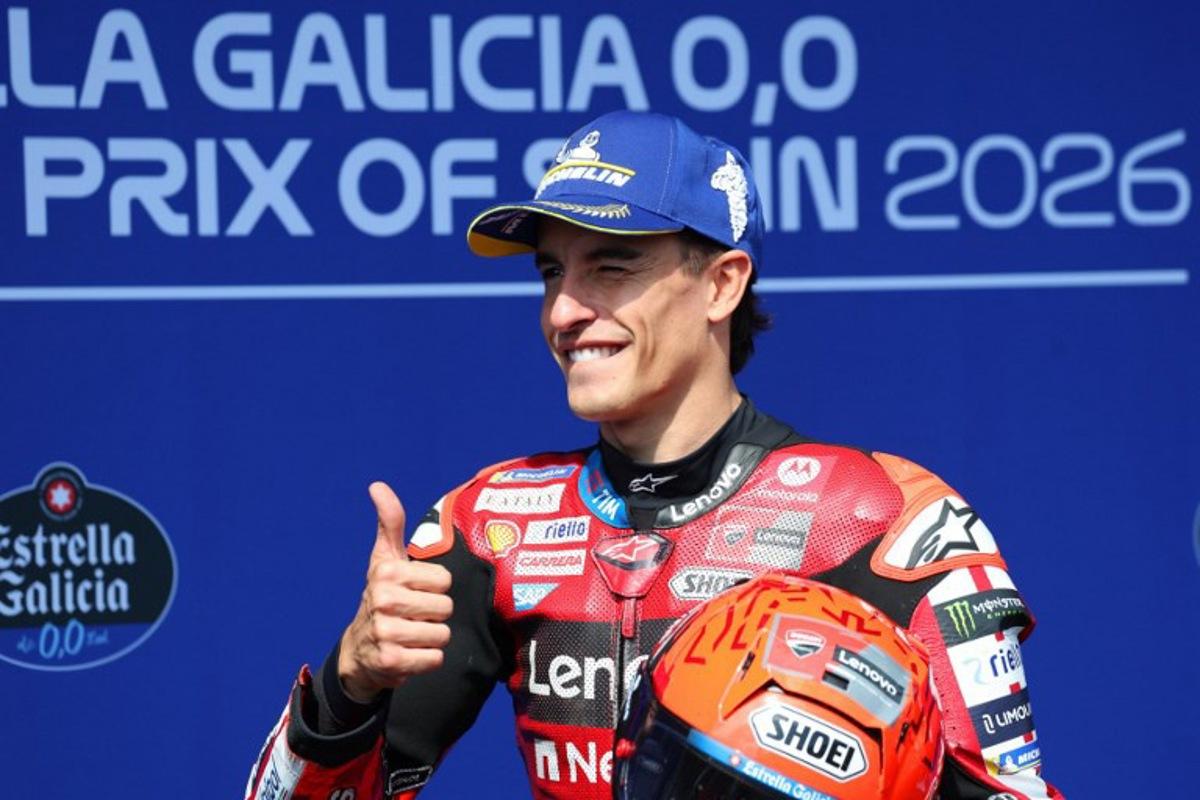 Ducati Lenovo Team's Marc Marquez celebrates getting the pole position after competing in the qualifying session of the MotoGP Spanish Grand Prix at the Jerez racetrack in Jerez de la Frontera, on April 25, 2026.    Pierre-Philippe MARCOU / AFP