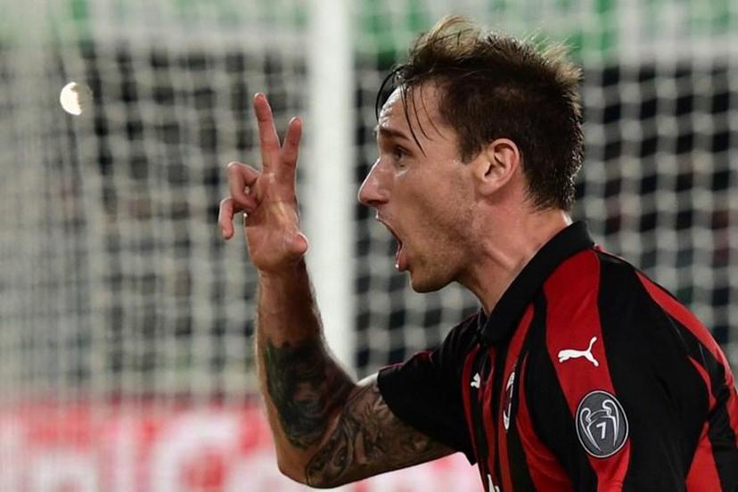 AC Milan's Argentine midfielder Lucas Biglia celebrates after scoring a free kick during the Italian Serie A football match Chievo Verona vs AC Milan on March 9, 2019 at the Marcantonio-Bentegodi stadium in Verona.   Miguel MEDINA / AFP
