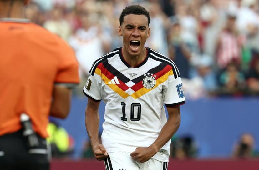 Germany's midfielder #10 Jamal Musiala reacts after scoring his penalty during the penalty shootout of the 2026 World Cup round of 32 football match between Germany and Paraguay at the Boston Stadium in Foxborough on June 29, 2026.   FRANCK FIFE / AFP