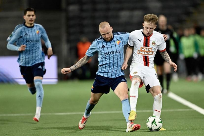 Djurgarden's Adam Stahl and Rapid Vienna's Isak Jansson vie for the ball during the quarter-final Conference League football match 1 of 2, between Djurgarden and SK Rapid Vienna in Stockholm on April 10, 2025.  Pontus LUNDAHL / TT NEWS AGENCY / AFP