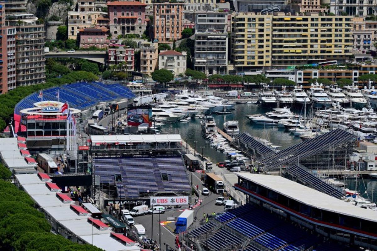 This photograph taken on May 22, 2024 shows yachts docked at the Monte Carlo harbour in front of the stands of the Circuit de Monaco, four days ahead of the Formula One Monaco Grand Prix.  Andrej ISAKOVIC / AFP
