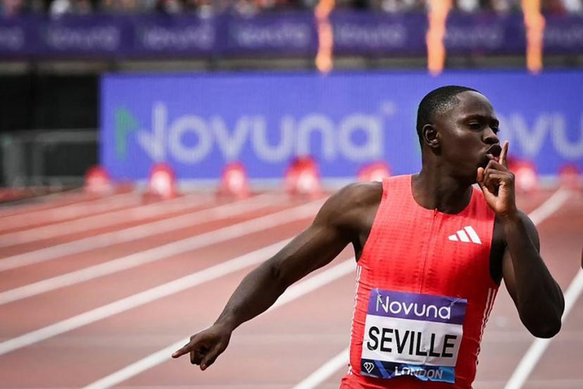 First-placed Jamaica's Oblique Seville celebrates as he crosses the finish to win the Men's 100m during the IAAF Diamond League athletics meeting, at the London stadium, in London, on July 19, 2025.  JUSTIN TALLIS / AFP