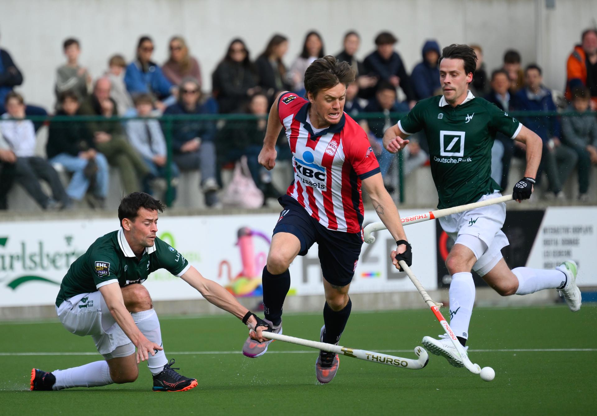 Watducks's Tommy Willems and Leopold's Tom Boon pictured in action during a hockey game between Royal Leopold and Waterloo Ducks, Sunday 30 March 2025 in Ukkel/ Uccle, Brussels, on day 16 of the Belgian first division hockey championship. BELGA PHOTO JOHN THYS