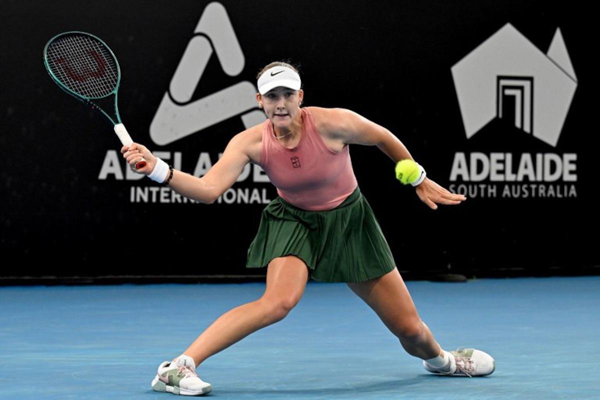 Russia's Mirra Andreeva hits a return to her compatriot Diana Shnaider during their women's singles semi-final match at the Adelaide International tennis tournament in Adelaide on January 16, 2026.  Michael ERREY / AFP