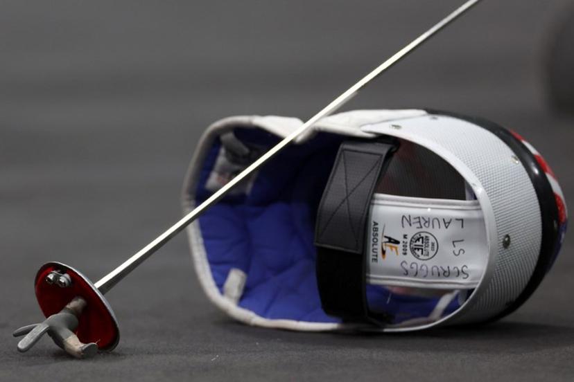 The helmet and sword of US' Lauren Scruggs are seen as she competes Canada in the women's foil team semi-final bout between Canada and USA during the Paris 2024 Olympic Games at the Grand Palais in Paris, on August 1, 2024.  Franck FIFE / AFP