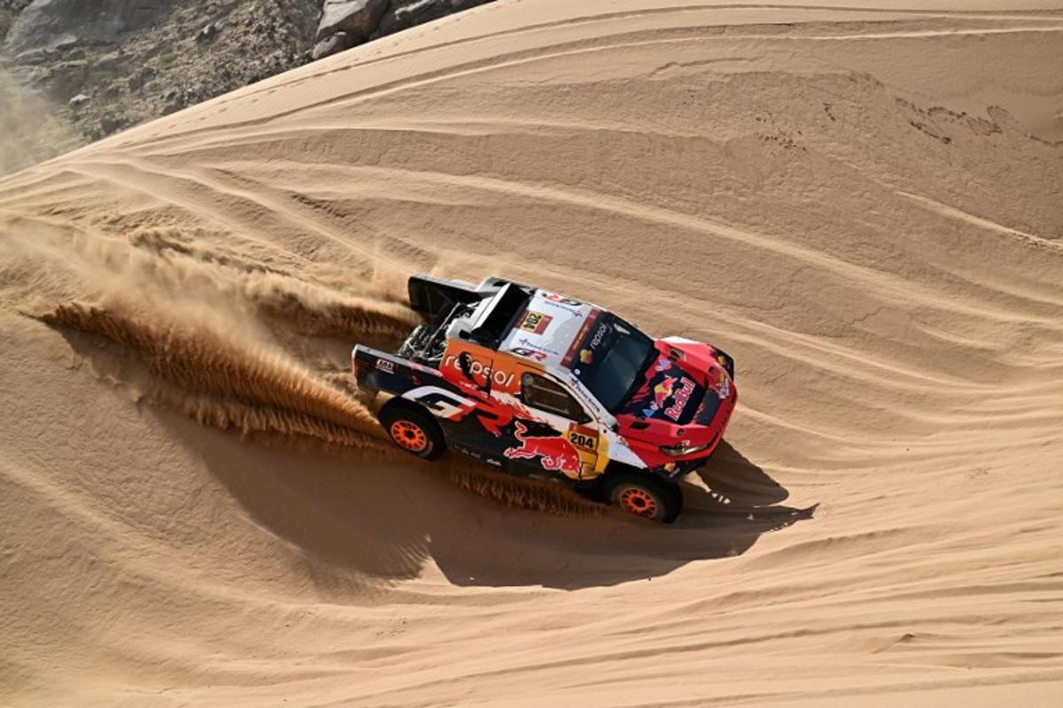 Toyota Gazoo Racing W2rc's Australian driver Toby Price and Spanish copilot Armand Monleon compete in Stage 12 of the 48th edition of the Dakar Rally 2026, between al-Henakiyah and Yanbu, Saudi Arabia, on January 16, 2026.  Giuseppe CACACE / AFP