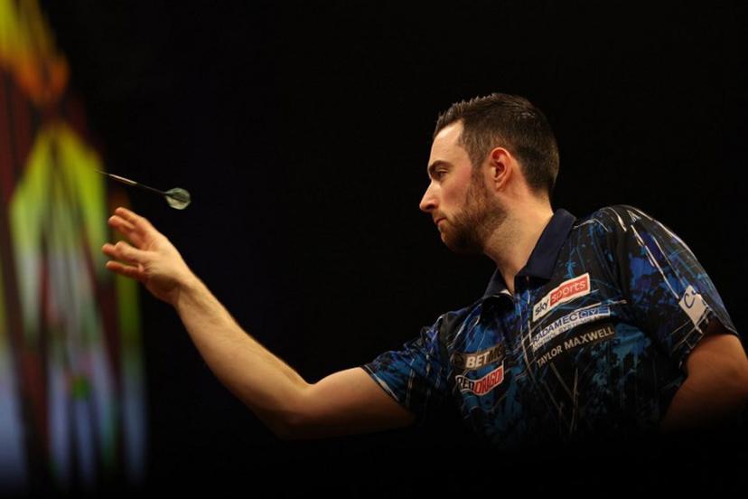 England's Luke Humphries competes during his quarter-final darts match against England's Luke Littler on Night 1 of the PDC Premier League, at the Utilita Arena in Cardiff, south Wales on February 1, 2024.  Adrian DENNIS / AFP