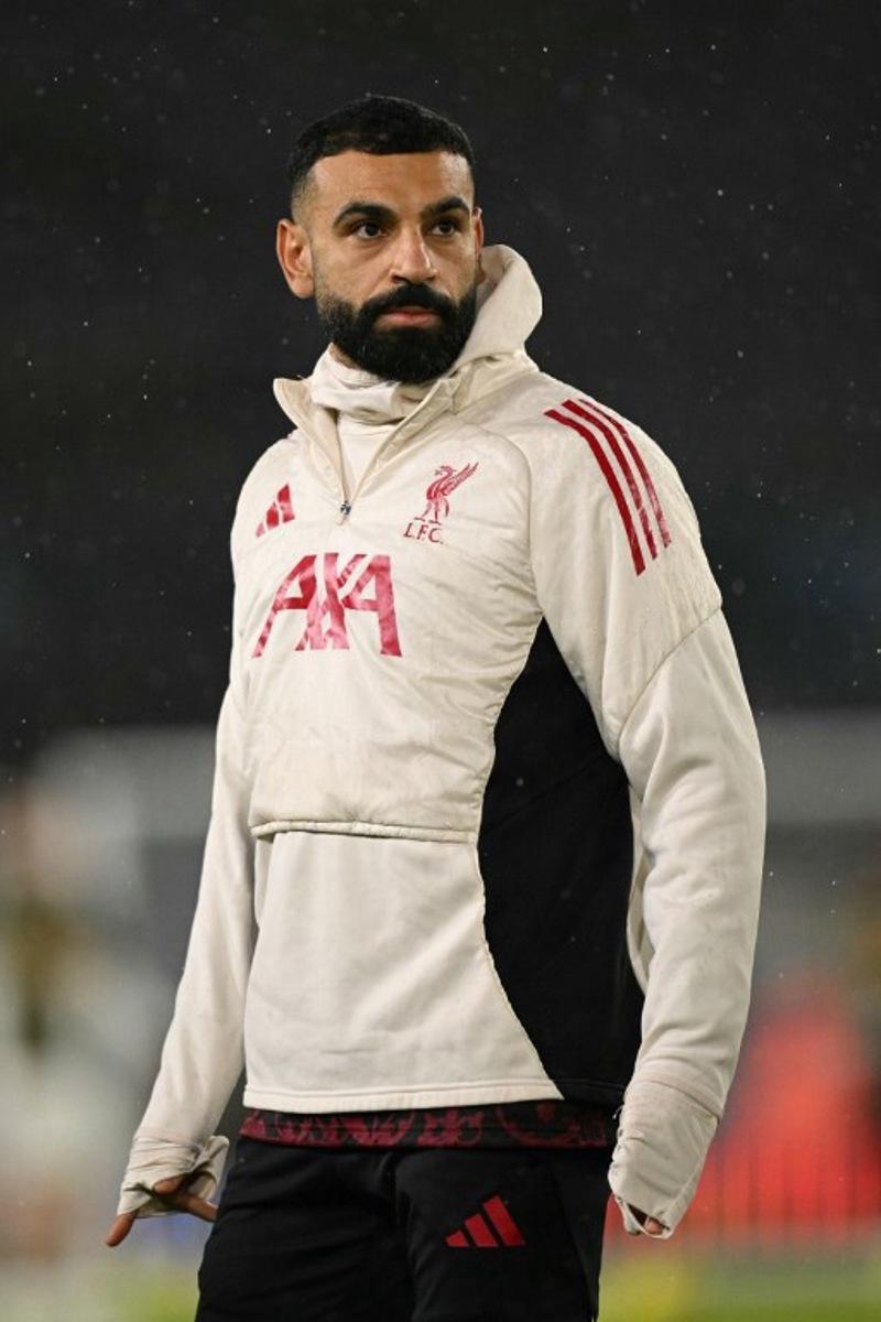 Liverpool's Egyptian striker #11 Mohamed Salah warms up ahead of the English Premier League football match between Leeds United and Liverpool at Elland Road in Leeds, northern England on December 6, 2025.  Oli SCARFF / AFP