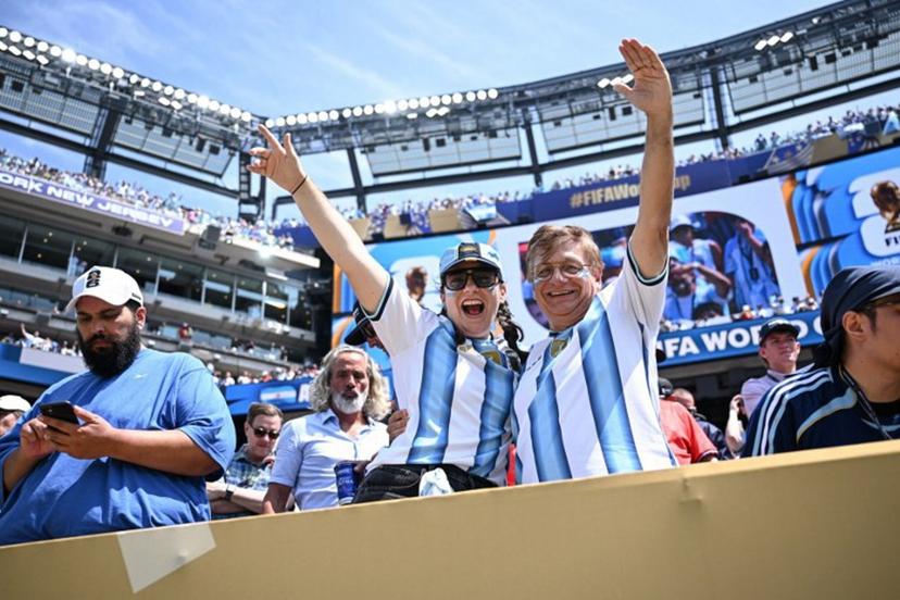 Argentina fans pose for a photo ahead of the 2026 World Cup football tournament final match between Spain and Argentina at the New York/New Jersey Stadium in East Rutherford on July 19, 2026.   Paul ELLIS / AFP