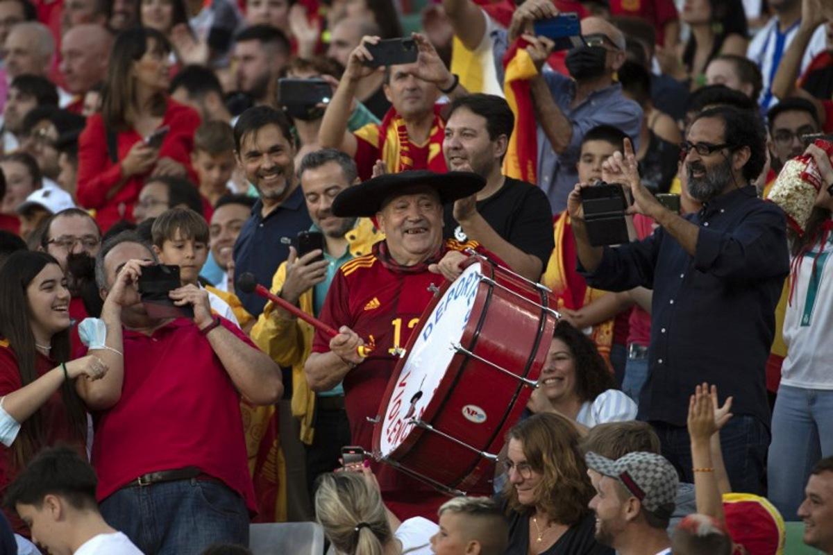 Well-known Spain fan Manuel Caceres Artesero, also known as "Manolo El del Bombo" (Manolo the Marching Bass Drummer), cheers on his team during the UEFA Nations League, league A group 2 football match between Spain and Portugal, at the Benito Villamarin stadium in Seville on June 2, 2022.  JORGE GUERRERO / AFP