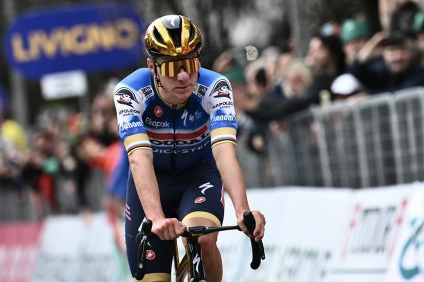 Soudal Quick-Step team's Belgian rider Remco Evenepoel cycles to the finish line to take second place in the 118th edition of the Giro di Lombardia (Tour of Lombardy), a 252km cycling race from Bergamo to Como on October 12, 2024.  Marco BERTORELLO / AFP