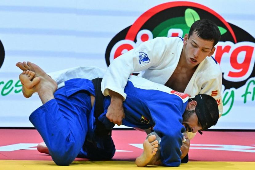 Georgia's Tato Grigalashvili competes against International Judo Federation's Timur Arbuzov in the men's -81kg final of the Judo World Championships at Papp Laszlo Arena in Budapest, Hungary, on June 16, 2025.    Attila KISBENEDEK / AFP
