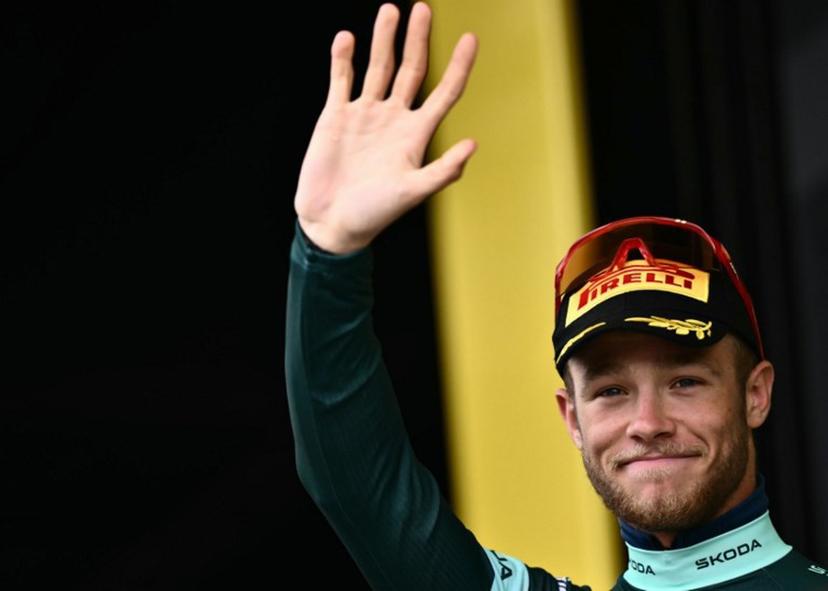 Lidl - Trek team's Italian rider Jonathan Milan celebrates on the podium with the best sprinter's green jersey after the 20th stage of the 112th edition of the Tour de France cycling race, 184.2 km between Nantua and Pontarlier, in the Jura, eastern France, on July 26, 2025.  Marco BERTORELLO / AFP