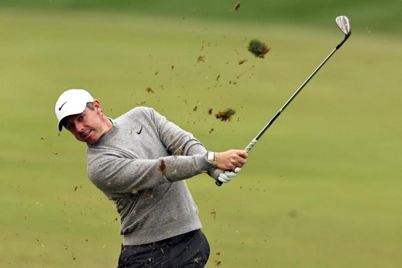 Rory McIlroy of Northern Ireland plays a shot on the 1st hole during the Hero Dubai Desert Classic golf tournament at the Emirates Golf Club in Dubai on January 25, 2026.  Fadel SENNA / AFP