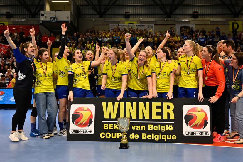 Sint Truiden's players, celebrate and after winning the cup during a game between KTSV Eupen and HB Sint-Truiden, the women's final of the Belgian handball cup, Saturday 01 April 2023, in Hasselt. BELGA PHOTO JOHAN EYCKENS