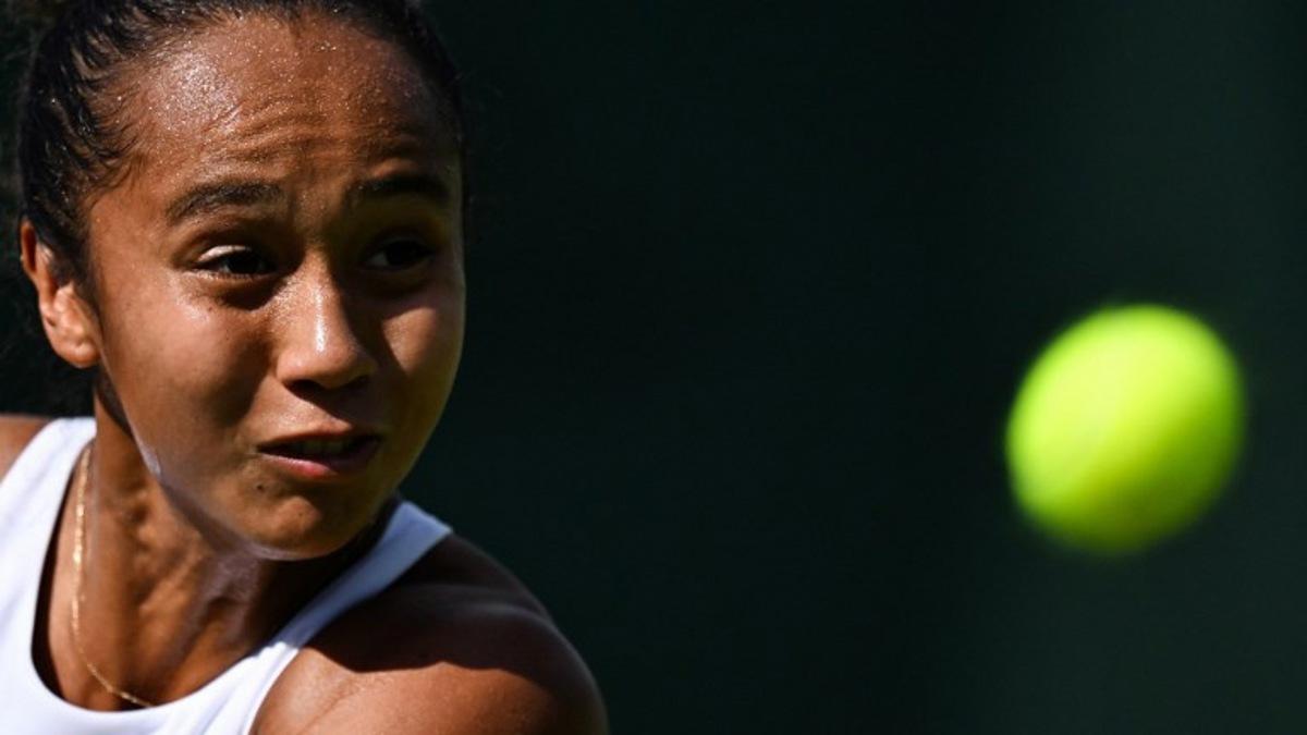 Canada's Leylah Fernandez eyes the ball as she returns it to Britain's Hannah Klugman during their women's singles first round tennis match on the first day of the 2025 Wimbledon Championships at The All England Lawn Tennis and Croquet Club in Wimbledon, southwest London, on June 30, 2025.  Kirill KUDRYAVTSEV / AFP