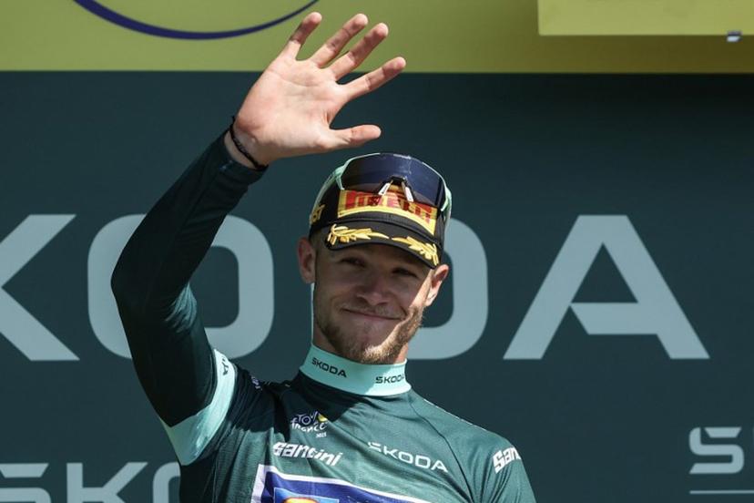 Lidl - Trek team's Italian rider Jonathan Milan celebrates on the podium with the best sprinter's green jersey after the 8th stage of the 112th edition of the Tour de France cycling race, 171.4 km between Saint-Meen-le-Grand and Laval Espace Mayenne, western France, on July 12, 2025.  Anne-Christine POUJOULAT / AFP
