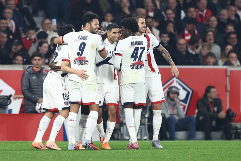 Paris Saint-Germain's players celebrate after scoring their first goal during the French L1 football match between Lille LOSC and Paris Saint-Germain (PSG) at the Stade Pierre-Mauroy in Villeneuve-d'Ascq, northern France, on October 5, 2025.  Sameer AL-DOUMY / AFP
