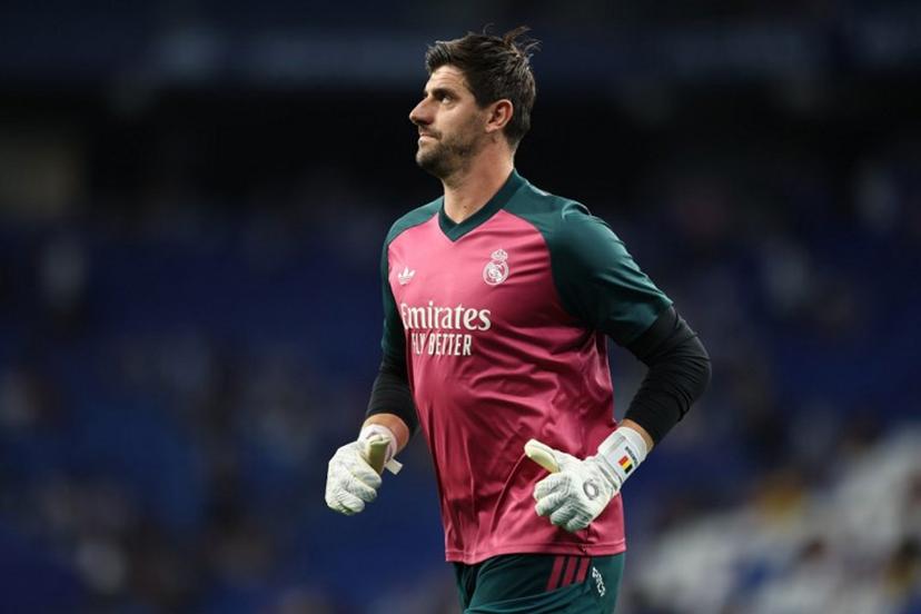 Real Madrid's Belgian goalkeeper #01 Thibaut Courtois warms up before the Spanish league football match between RCD Espanyol and Real Madrid CF at RCDE Stadium in Cornella de Llobregat on August 22, 2026.  Josep LAGO / AFP