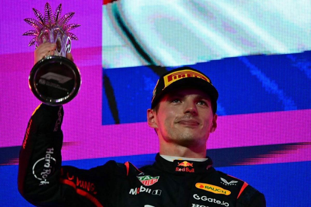 Second-placed Red Bull Racing's Dutch driver Max Verstappen lifts his trophy during podium celebrations following the 2025 Saudi Arabia Formula One Grand Prix at the Jeddah Corniche Circuit on April 20, 2025.  Giuseppe CACACE / AFP