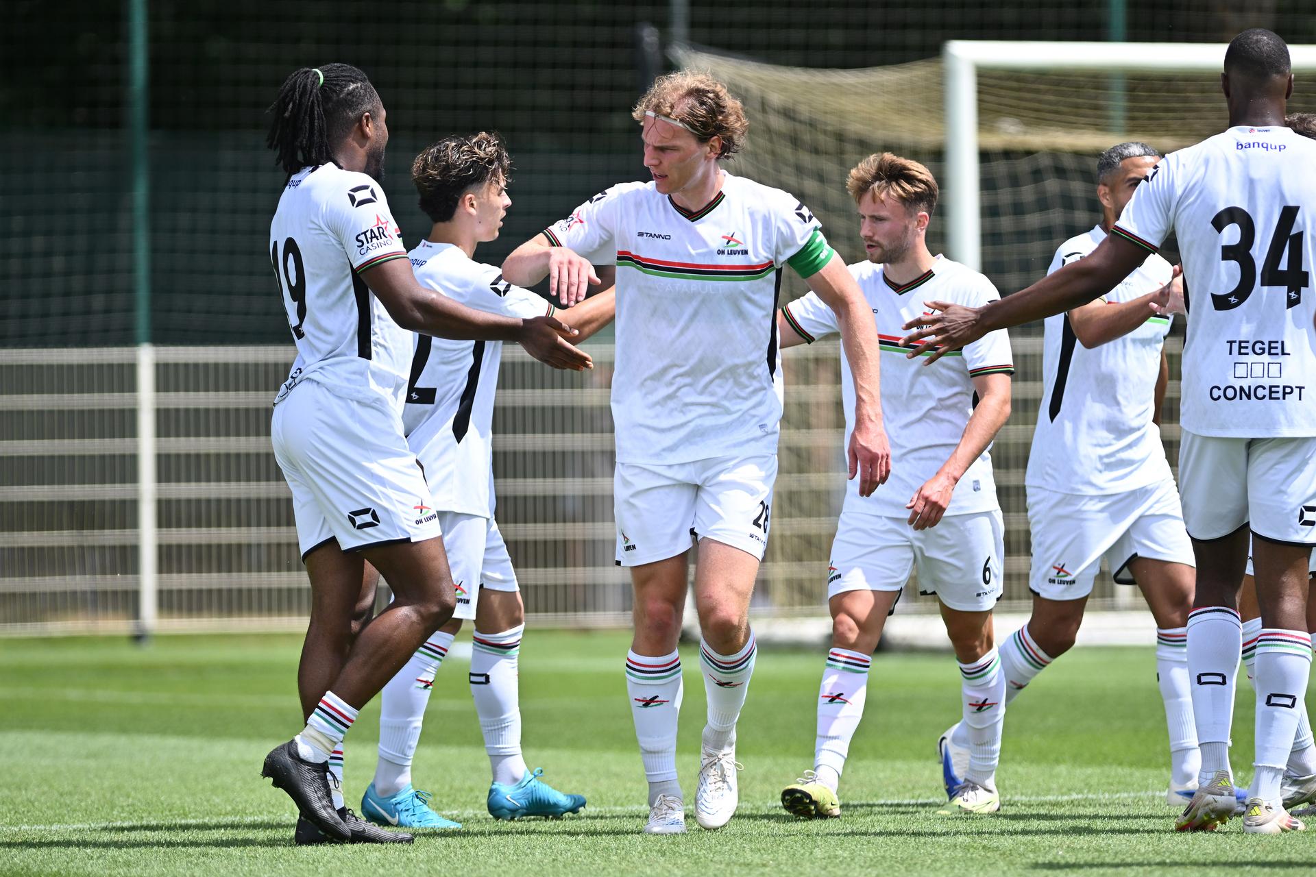 OHL's players celebrate after scoring during a friendly game between OH Leuven and Kessel-Lo, Saturday 28 June 2025 in Oud-Heverlee, in preparation of the upcoming 2025-2026 season. BELGA PHOTO LUC CLAESSEN