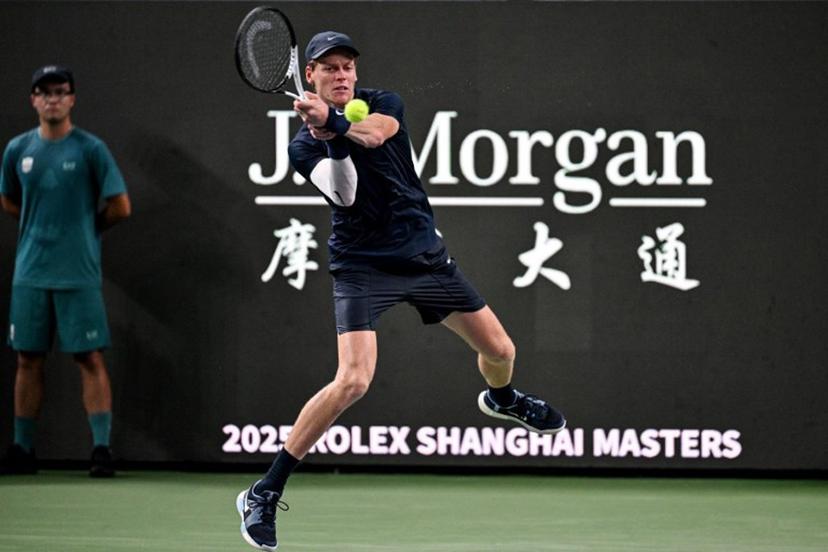Italy's Jannik Sinner hits a return to Netherlands' Tallon Griekspoor during their men's singles match at the Shanghai Masters tennis tournament in Shanghai on October 5, 2025.  Hector RETAMAL / AFP