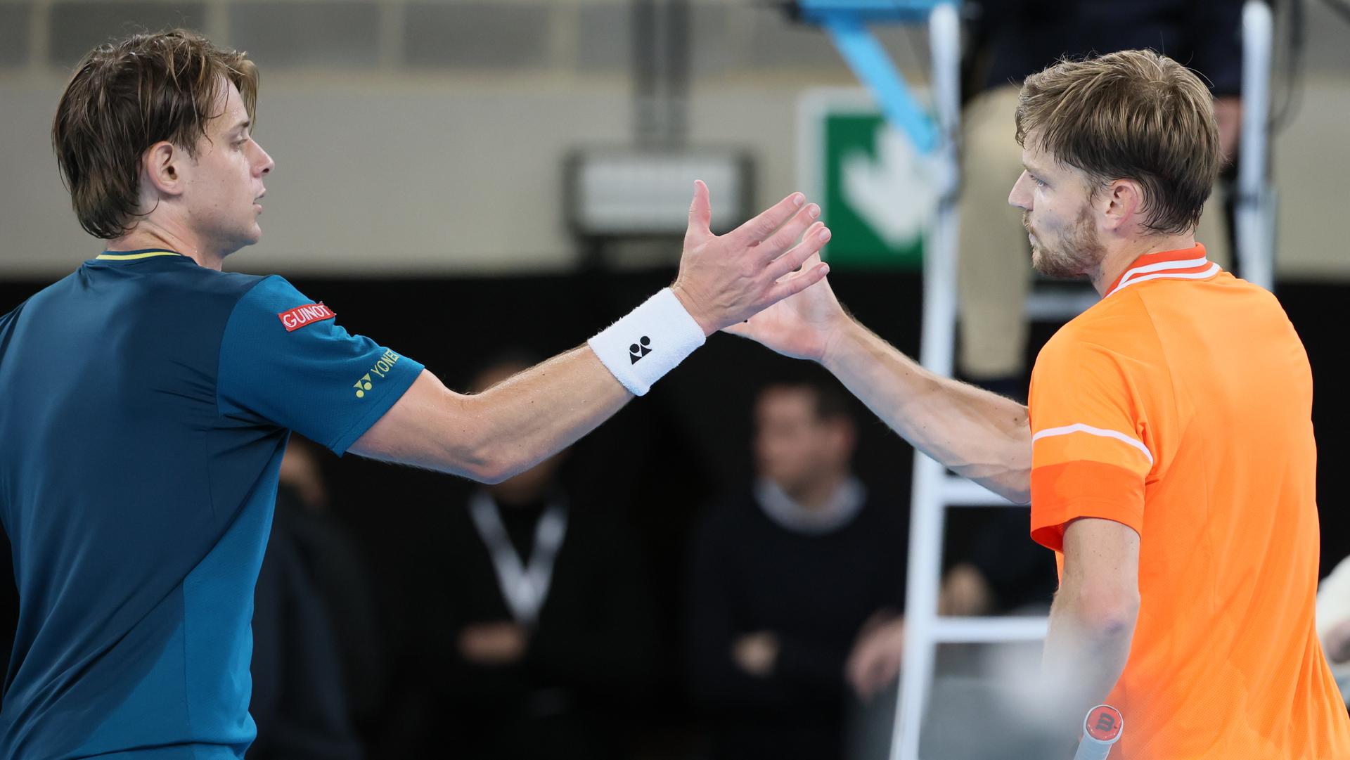 Belgian Zizou Bergs and Belgian David Goffin shake hands after their tennis match in the first round of the men's singles at the BW Open ATP Challenger 125 tournament, in Louvain-la-Neuve,  Tuesday 23 January 2024. THE BW Open takes place from 22 to 28 January.  BELGA PHOTO BENOIT DOPPAGNE