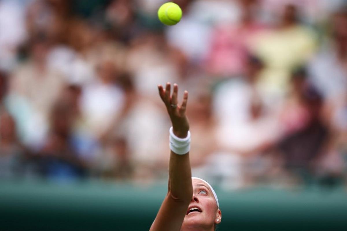 Czech Republic's Petra Kvitova serves the ball to US player Emma Navarro during their women's singles first round tennis match on the second day of the 2025 Wimbledon Championships at The All England Lawn Tennis and Croquet Club in Wimbledon, southwest London, on July 1, 2025.  HENRY NICHOLLS / AFP