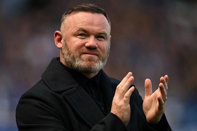 Former Everton player Wayne Rooney arrives on the pitch for the celebrations after the English Premier League football match between Everton and Southampton at Goodison Park in Liverpool, north west England on May 18, 2025, Everton's final premier league fixture played at the stadium, their home since 1892.  Paul ELLIS / AFP