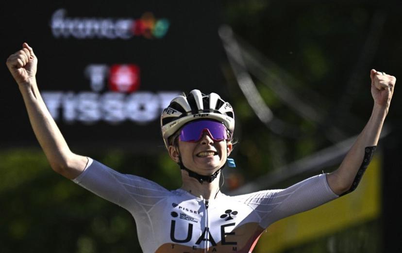 UAE Team ADQ's French rider Maeva Squiban celebrates as she crosses the finish line to win the 7th stage (out of 9) of the fourth edition of the Women's Tour de France cycling race, 159.7 km from Bourg-en-Bresse to Chambéry, in Chambéry, south-eastern France on August 1, 2025.  JULIEN DE ROSA / AFP