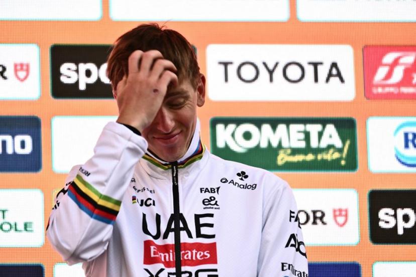 Team UAE's Slovenian rider Tadej Pogacar, third, during the podium ceremony of the Milan - Sanremo one-day classic cycling race, on March 22, 2025. Dutch Mathieu Van Der Poel of team Alpecin-Deceuninck won the race ahead of Team Ineos' Italian rider Filippo Ganna and Team UAE's Slovenian rider Tadej Pogacar, third.  Marco BERTORELLO / AFP