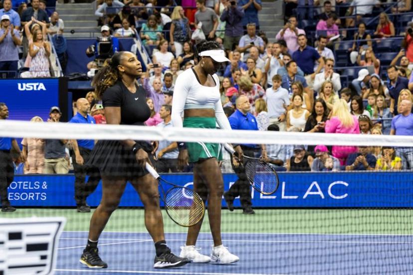 USA's Serena Williams (L) and Venus Williams leave the court after their loss against Czech Republic's Lucie Hradecka and Linda Noskova during their 2022 US Open Tennis tournament women's doubles first round match at the USTA Billie Jean King National Tennis Center in New York, on September 1, 2022.  COREY SIPKIN / AFP