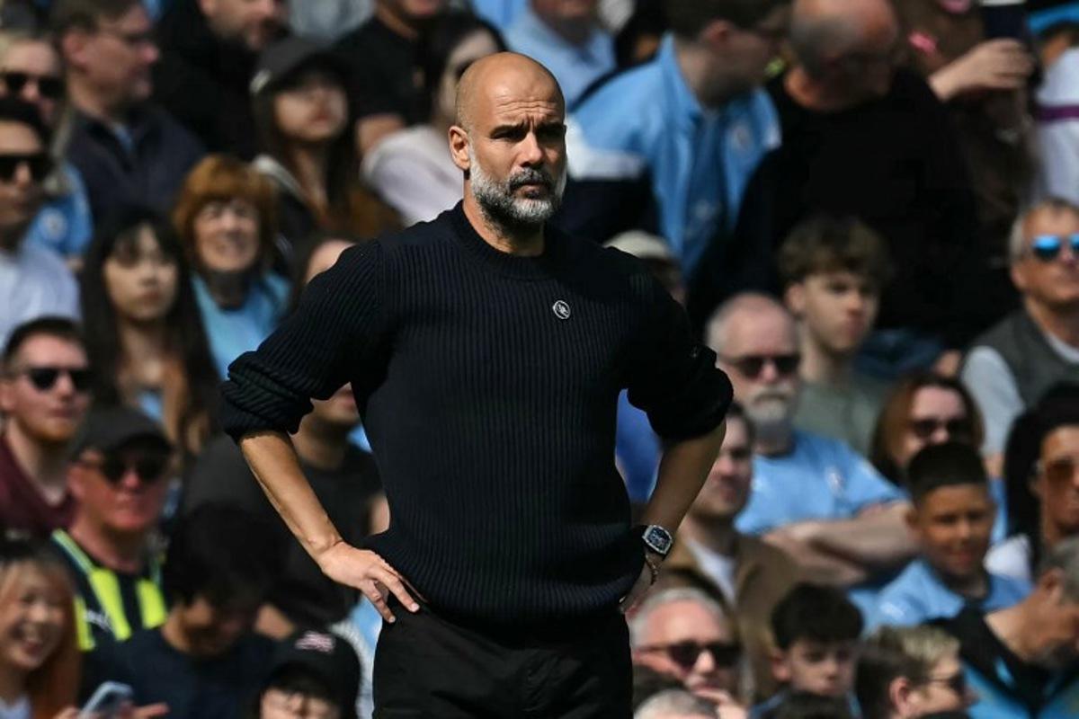 Manchester City's Spanish manager Pep Guardiola looks on during the English Premier League football match between Manchester City and Crystal Palace at the Etihad Stadium in Manchester, north west England, on April 12, 2025.  Paul ELLIS / AFP