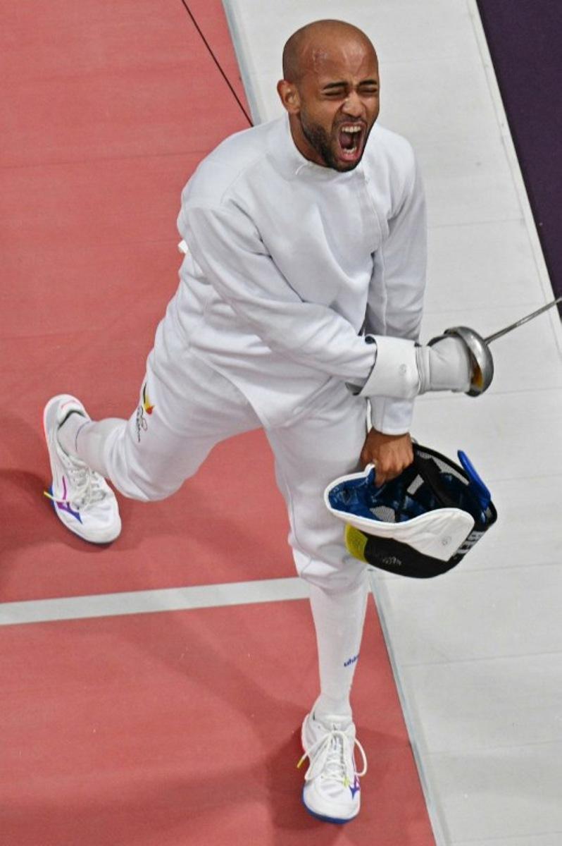 An overview shows Belgium's Neisser Loyola (L) reacting as he competes against Hungary's Gergely Siklosi in the men's epee individual round of 16 bout during the Paris 2024 Olympic Games at the Grand Palais in Paris, on July 28, 2024.  Jewel SAMAD / AFP