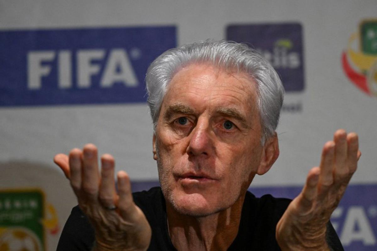South Africa's coach Hugo Broos gestures during a press conference ahead of FIFA World Cup 2026 Africa group qualifier football match between Sout Africa and Benin in Abidjan on March 24, 2025.  Issouf SANOGO / AFP