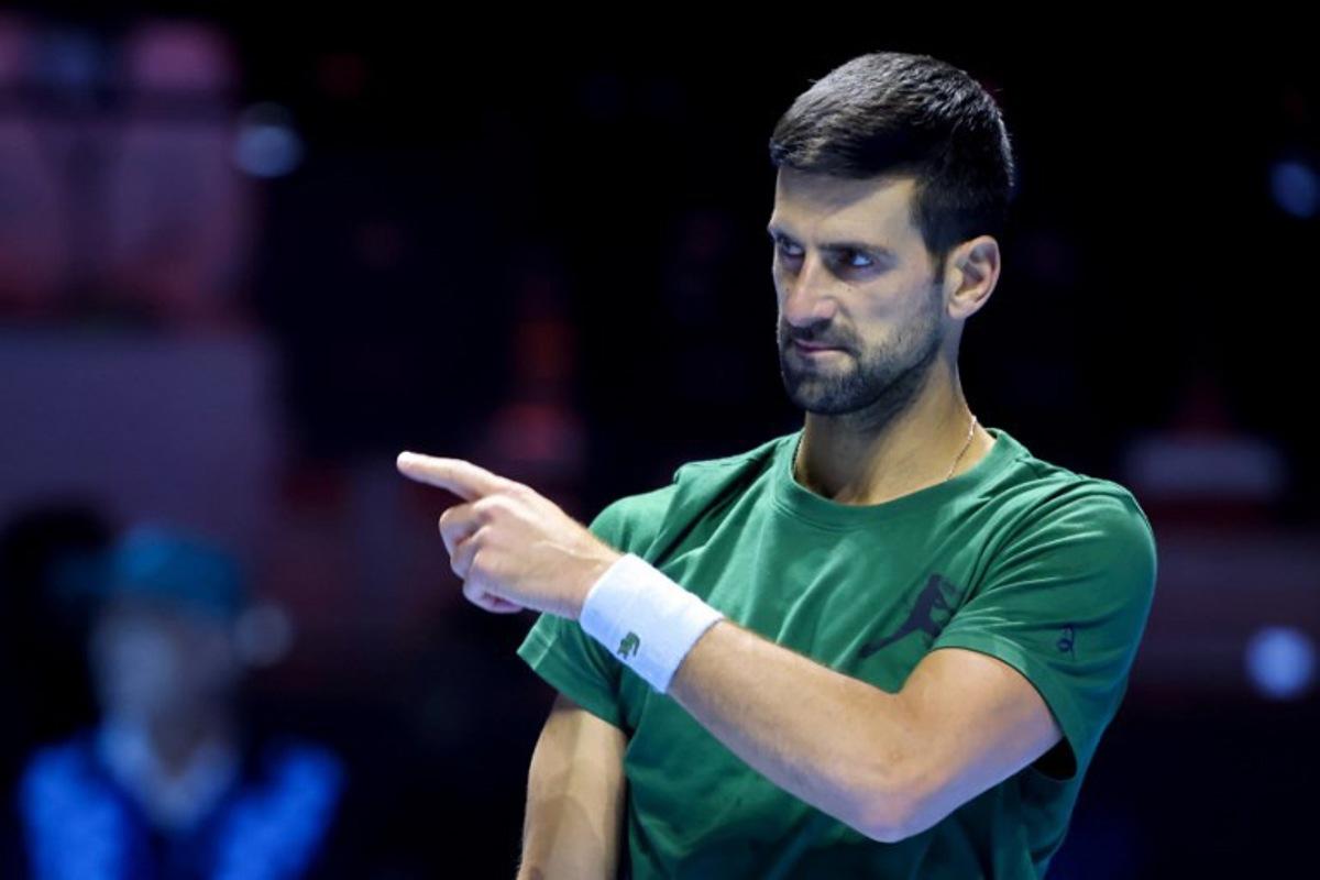 Serbia's Novak Djokovic gestures during the warm up ahead of the semi-final of the Six Kings Slam exhibition tennis tournament against Italy's Jannik Sinner in Riyadh on October 16, 2025.  Fayez NURELDINE / AFP